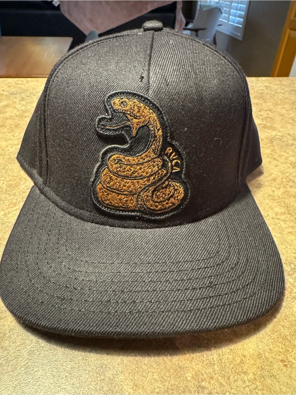 RVCA Black Hat with Brown Snake Patch